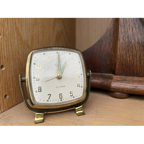 1721 - THREE VARIOUS CLOCKS TO INCLUDE AN OAK NAPOLEANS HAT WESTMINISTER CHIMING CLOCK ETC