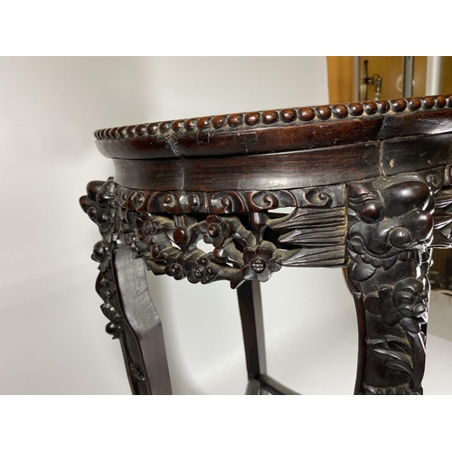 454 - A CHINESE CARVED ROSEWOOD AND MARBLE TOPPED JARDINIERE STAND, HEIGHT 62CM