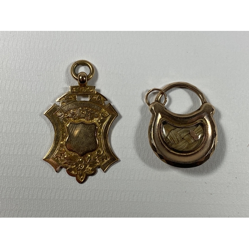 693 - A 9CT YELLOW GOLD FOB PENDANT AND A YELLOW METAL MEMORIAL LOCKET PENDANT, GOLD WEIGHT 4.65G