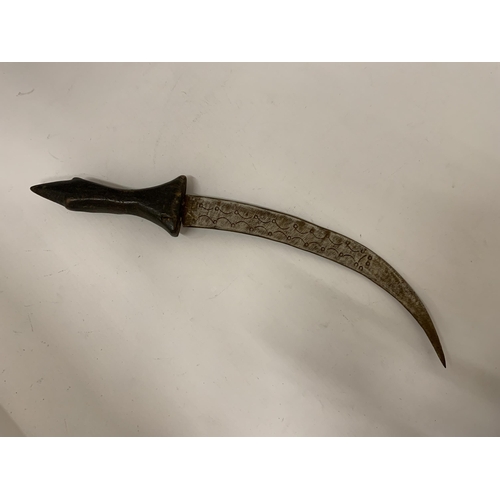 101 - A MIDDLE EASTERN STYLE DAGGER WITH CARVED FACE TO HANDLE