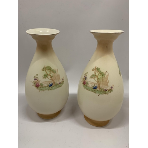 106 - A PAIR OF VINTAGE CROWN DUCAL BALUSTER VASES IN BLUSH IVORY WITHA BIRD DESIGN HEIGHT 31.5CM