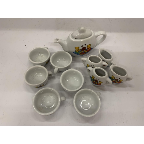 118 - A MINIATURE CHILD'S POTTERY TEASET TO INCLUDE TEAPOT, JUGS, CUPS, ETC WITH A TEDDY BEARS PICNIC DESI... 