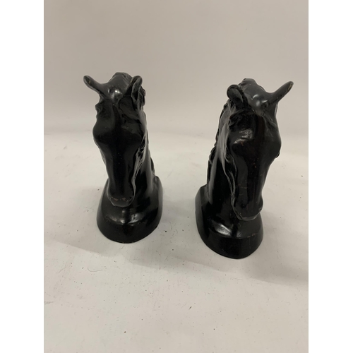 130 - A PAIR OF STONE BLACK HORSES HEAD BOOK-ENDS HEIGHT 14CM