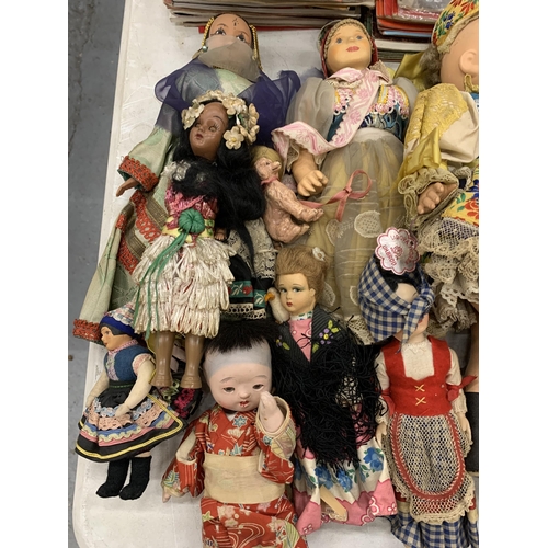 173 - A LARGE QUANTITY OF VINTAGE DOLLS IN TRADITIONAL COSTUME TO INCLUDE CERAMIC AND CLOTH