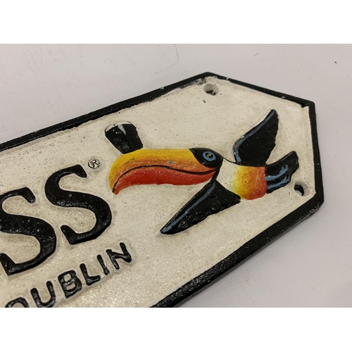 195 - A CAST GUINNESS SIGN 39CM X 10CM