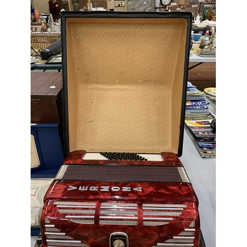 232 - A STUDENTS VERMONA WEITMEISTER RED ACCORDIAN IN A CASE