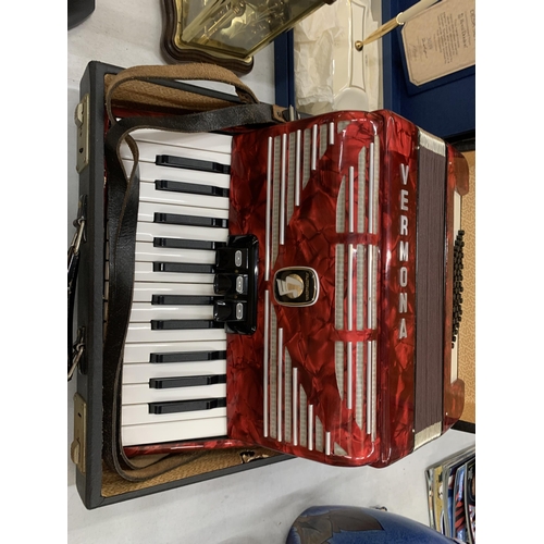 232 - A STUDENTS VERMONA WEITMEISTER RED ACCORDIAN IN A CASE