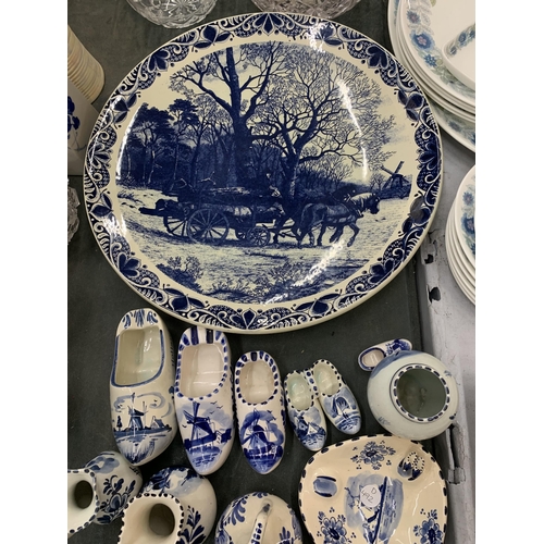 254 - A QUANTITY OF BLUE AND WHITE DELFT POTTERY TO INCLUDE A LARGE PLATE WITH HORSE AND CART DESIGN, CLOG... 