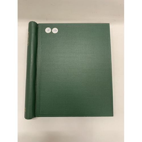 274 - A GREEN LEATHER STAMP ALBUM CONTAINING BRITISH STAMPS