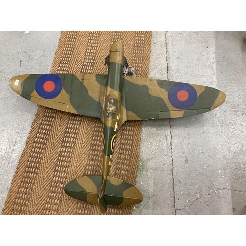 843 - A LARGE MODEL OF A SPITFIRE PLANE LENGTH 103CM