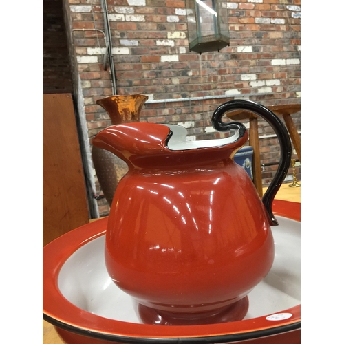 1019 - A LARGE CRIMSON WASHBOWL AND JUG