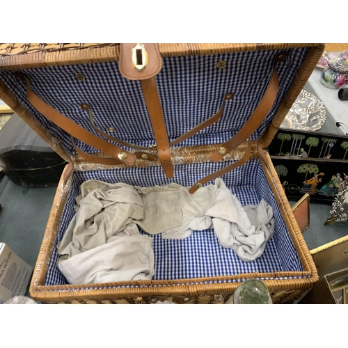 920 - A WICKER PICNIC BASKET PLUS A QUANTITY OF GLASS DECANTERS