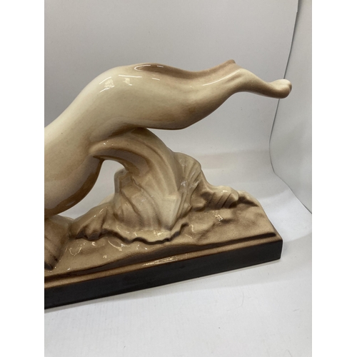 944 - A LARGE CERAMIC GREYHOUND LENGTH 43CM