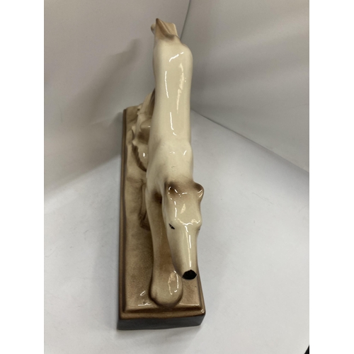 944 - A LARGE CERAMIC GREYHOUND LENGTH 43CM