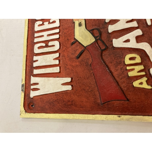 980 - A CAST WINCHESTER RIFLES SIGN 31CM X 17CM