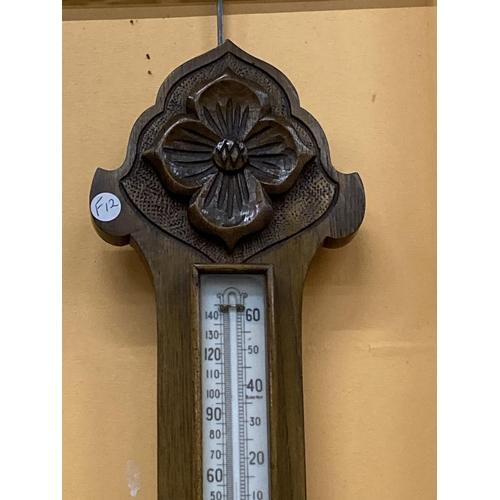 995 - A VINTAGE MAHOGANY BAROMETER WITH CARVING TO TOP AND BOTTOM