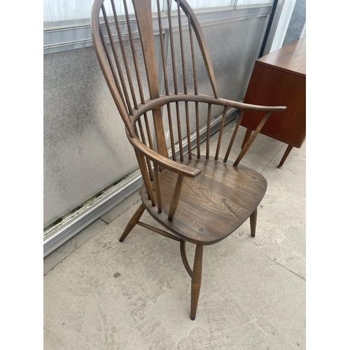 2502 - AN ERCOL ELM WINDSOR CHAIR WITH SPINDLE BACK AND SIDES, WITH CRINOLIN BOW