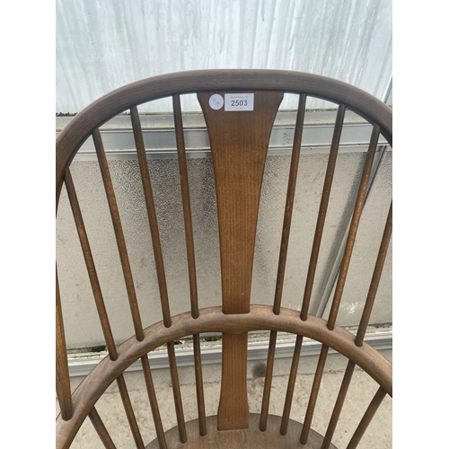 2503 - AN ERCOL ELM WINDSOR CHAIR WITH SPINDLE BACK AND SIDES, WITH CRINOLIN BOW