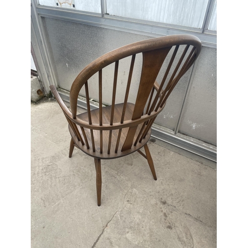 2503 - AN ERCOL ELM WINDSOR CHAIR WITH SPINDLE BACK AND SIDES, WITH CRINOLIN BOW