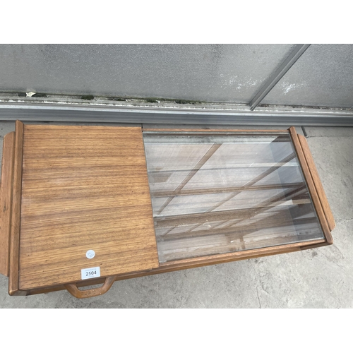 2504 - A RETRO TEAK G-PLAN E.GOMME COFFEE TABLE WITH GLASS TOP AND PULL THROUGH DRAWER, 35 X 16