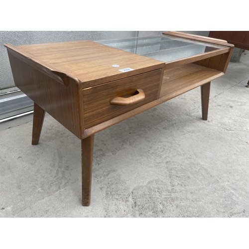 2504 - A RETRO TEAK G-PLAN E.GOMME COFFEE TABLE WITH GLASS TOP AND PULL THROUGH DRAWER, 35 X 16