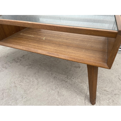 2504 - A RETRO TEAK G-PLAN E.GOMME COFFEE TABLE WITH GLASS TOP AND PULL THROUGH DRAWER, 35 X 16