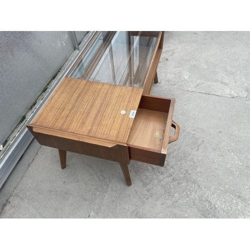 2504 - A RETRO TEAK G-PLAN E.GOMME COFFEE TABLE WITH GLASS TOP AND PULL THROUGH DRAWER, 35 X 16