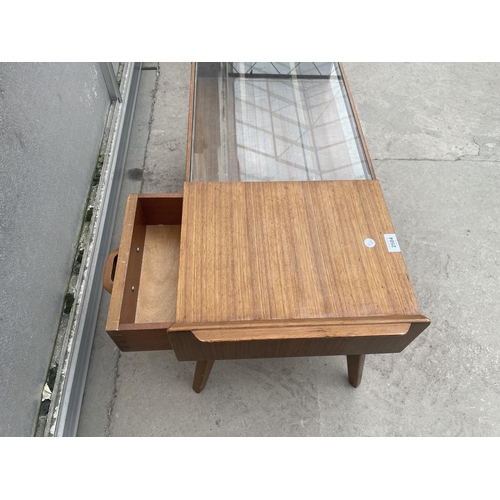 2504 - A RETRO TEAK G-PLAN E.GOMME COFFEE TABLE WITH GLASS TOP AND PULL THROUGH DRAWER, 35 X 16