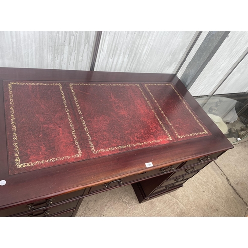 2507 - A MAHOGANY TWIN PEDESTAL DESK ENCLOSING EIGHT DRAWERS WITH INSET LEATHER TOP, 54X30