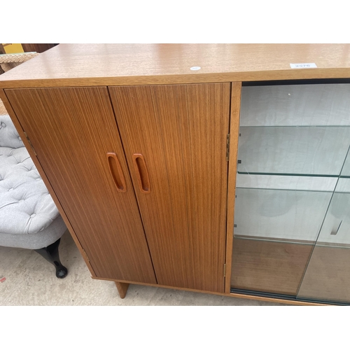 2576 - A RETRO TEAK STORAGE UNIT ENCLOSING TWO DOORS AND AN OPEN SECTION, 48