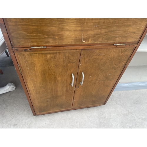 2773 - A MID 20TH CENTURY BUREAU CABINET, 26