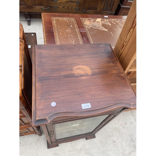 2779 - A LATE VICTORIAN MAHOGANY CABINET WITH GLASS DOOR ON OGEE FEET WITH CASTERS, 19