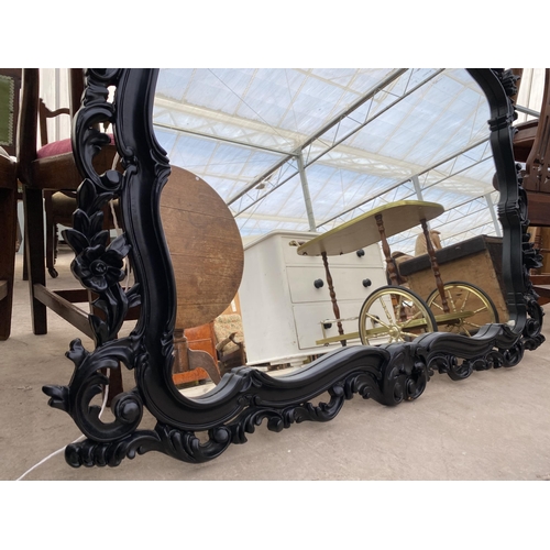 2696 - A 19TH CENTURY STYLE BLACK ROCOCO WALL MIRROR, 46X44