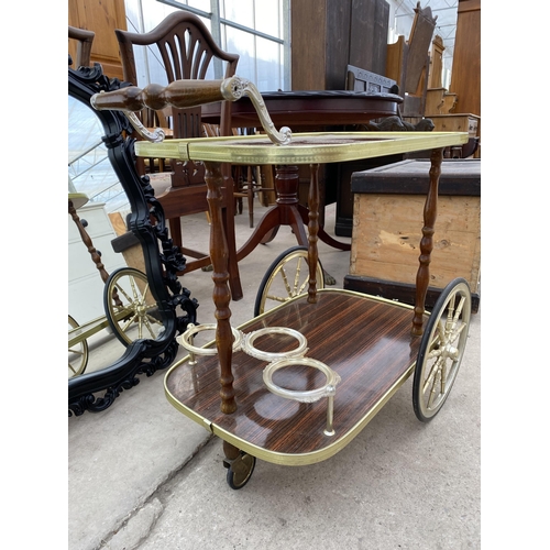 2697 - A 1970'S TWO TIER TROLLEY WITH THREE BOTTLE HOLDER AND TWO LARGE WAGON STYLE WHEELS