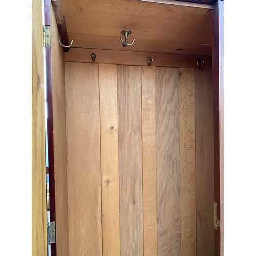 2705 - AN EDWARDIAN MAHOGANY AND INLAID MIRRORED TWO DOOR WARDROBE WITH TWO DRAWERS TO THE BASE, 58