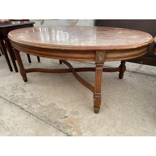 2711 - A PAIR OF OVAL COFFEE TABLES ON FLUTED LEGS WITH APPLIED EMBOSSED BRASS DECORATION