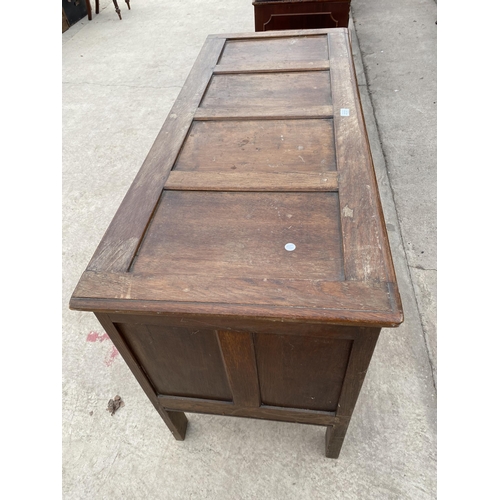 2727 - A OAK BLANKET CHEST WITH FOUR CARVED FRONT PANELS, 51