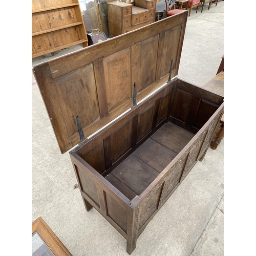 2727 - A OAK BLANKET CHEST WITH FOUR CARVED FRONT PANELS, 51