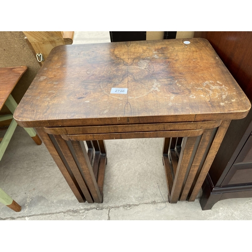 2740 - A NEST OF THREE ART DECO MID 20TH CENTURY WALNUT TABLES