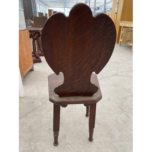 2747 - A VICTORIAN OAK HALL CHAIR WITH CARVED FOLIATE BACK