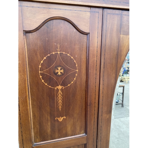 2760 - AN EDWARDIAN MAHOGANY AND INLAID MIRROR-DOOR WARDROBE AND MATCHING CHEST OF THREE DRAWERS