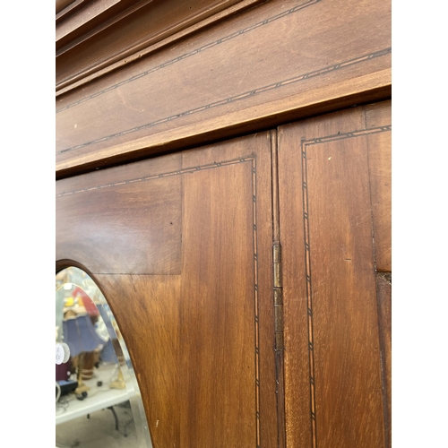 2760 - AN EDWARDIAN MAHOGANY AND INLAID MIRROR-DOOR WARDROBE AND MATCHING CHEST OF THREE DRAWERS