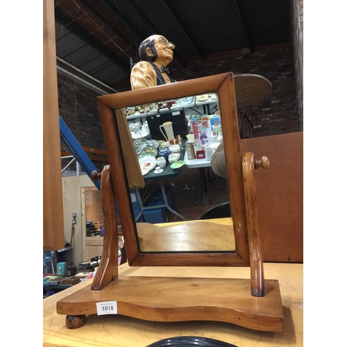 1018 - AN OAK FRAMED DRESSING TABLE MIRROR