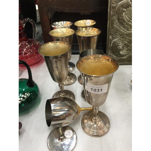 1031 - EIGHT SILVER PLATED WINE GOBLETS - 1 A/F