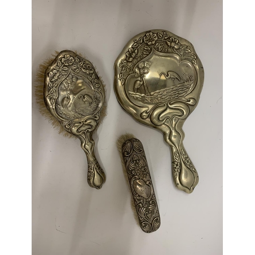 105 - A SILVER PLATED VINTAGE DRESSING TABLE BRUSH AND HAND MIRROR SET IN AN ART NOUVEAU STYLE