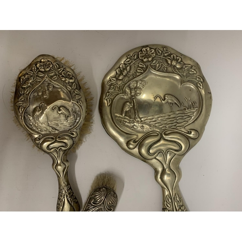 105 - A SILVER PLATED VINTAGE DRESSING TABLE BRUSH AND HAND MIRROR SET IN AN ART NOUVEAU STYLE