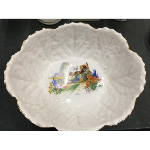 1055 - A LARGE COPELAND SPODE CHINA BOWL WITH CABBAGE LEAF DESIGN AND A COTTAGE SCENE TO THE INSIDE