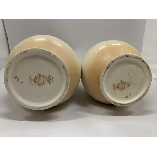 106 - A PAIR OF VINTAGE CROWN DUCAL BALUSTER VASES IN BLUSH IVORY WITHA BIRD DESIGN HEIGHT 31.5CM