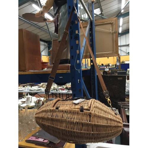 1061 - AN UNUSUAL OVOID SHAPED WICKER  PICNIC BASKET WITH ACCESSORIES