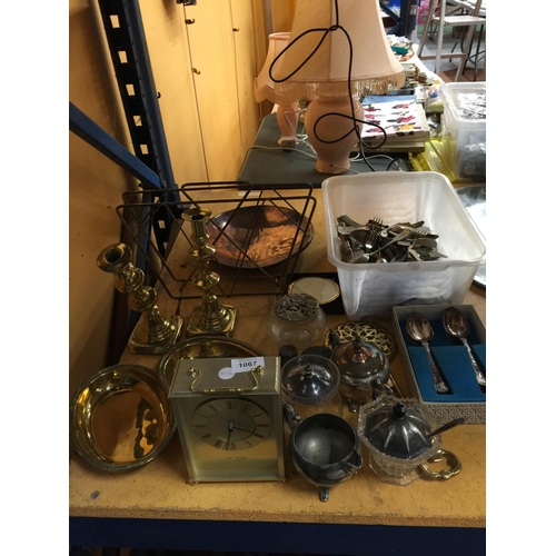 1067 - A LARGE MIXED LOT TO INCLUDE FLATWARE, A COPPER DISH, CARRIAGE CLOCK, BRASS CANDLESTICKS AND BOWLS, ... 